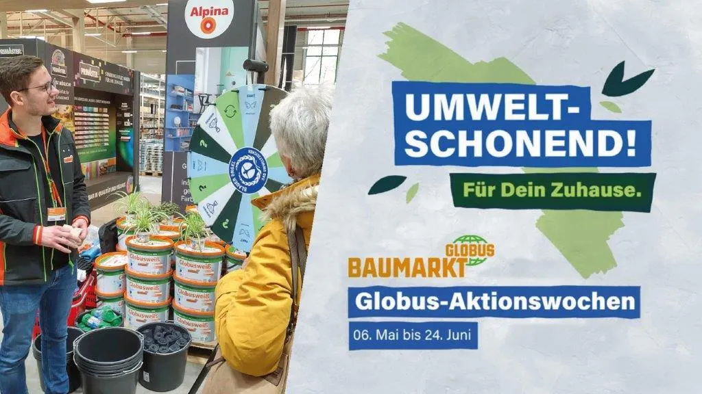 Two people in front of a wheel of fortune and buckets of paint in the Globus DIY store.