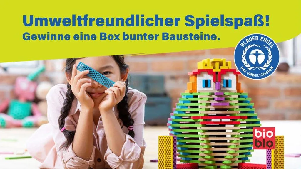 Girl holding a bioblo brand building block in front of her face. Next to her is a building block tower and the Blue Angel logo. Above it is the text Environmentally friendly fun! Win a box of colorful building blocks.