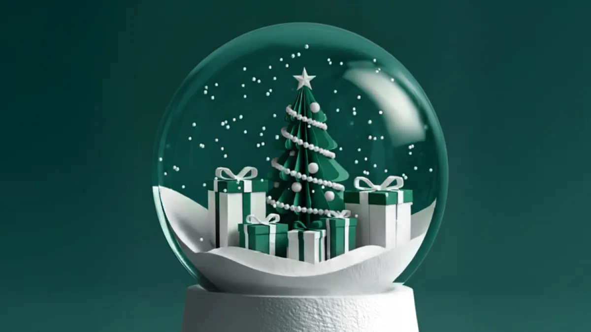 Schneekugel, gefüllt mit geschenken und einem Weihnachtsbaum.